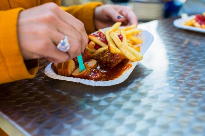 Eating delicious Currywurst