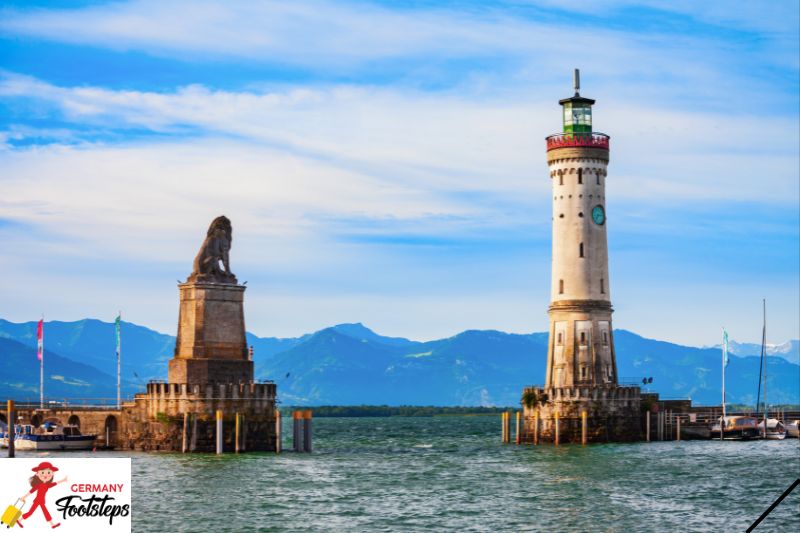 Lion statue and Lighthouse guarding the entrance to Lindau Harbor